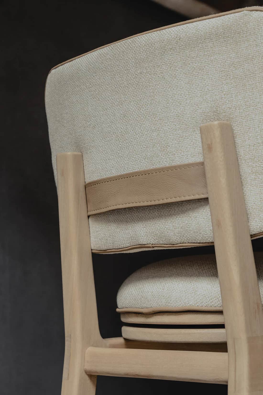 The image features a close-up, angled view of a modern wooden chair. The chair consists of a light-t… — 3D model