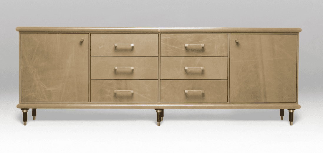 A long, contemporary credenza featuring a full leather wrapping in a light tan color. It has two cab… — 3D model