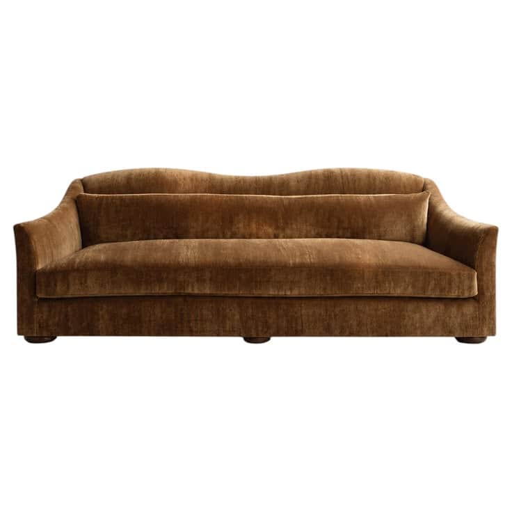 A sophisticated sofa upholstered in rich bronze velvet, featuring a distinctive wavy backrest and el… — 3D model