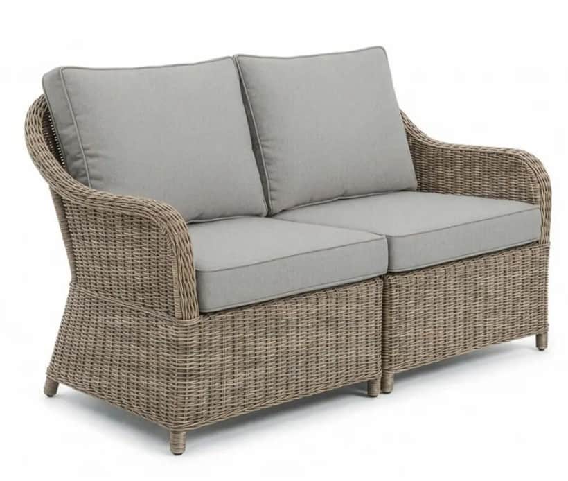 A two-seater sofa constructed with a woven wicker-like material for the base and arms, featuring uph… — free FBX 3D model