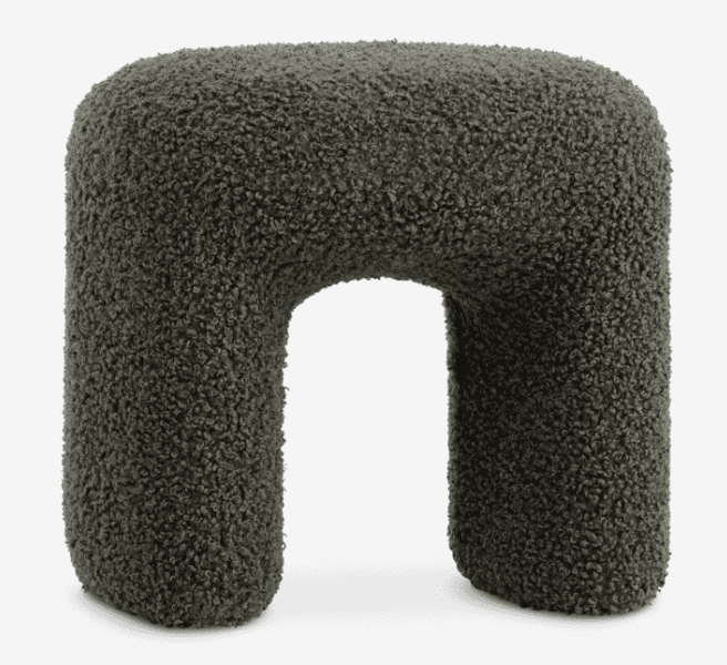 A contemporary U-shaped stool upholstered in a dark green boucle fabric. The stool features soft, ro… — 3D model