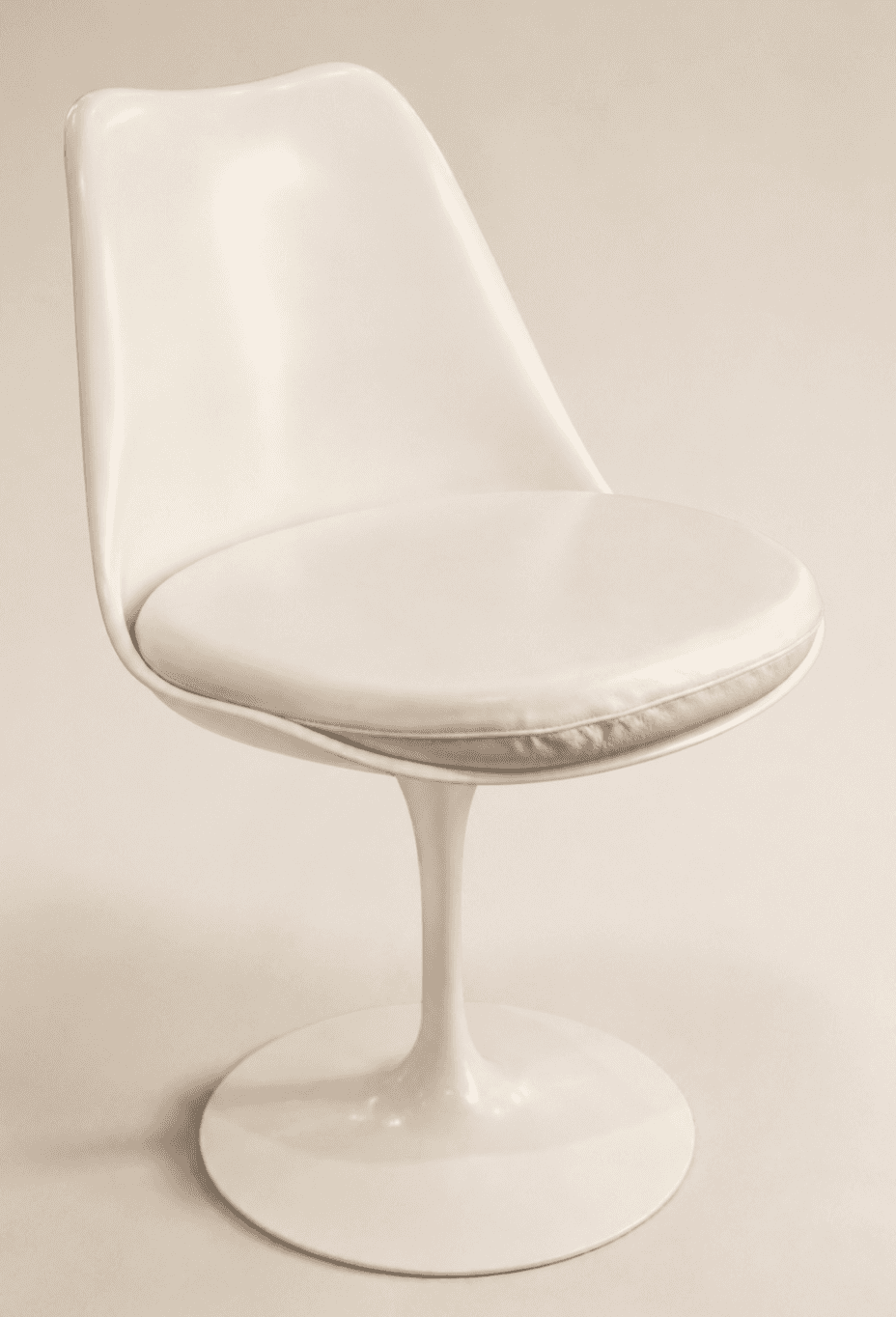 An off-white, armless dining chair featuring a molded fiberglass or plastic shell seat with an integ… — 3D model