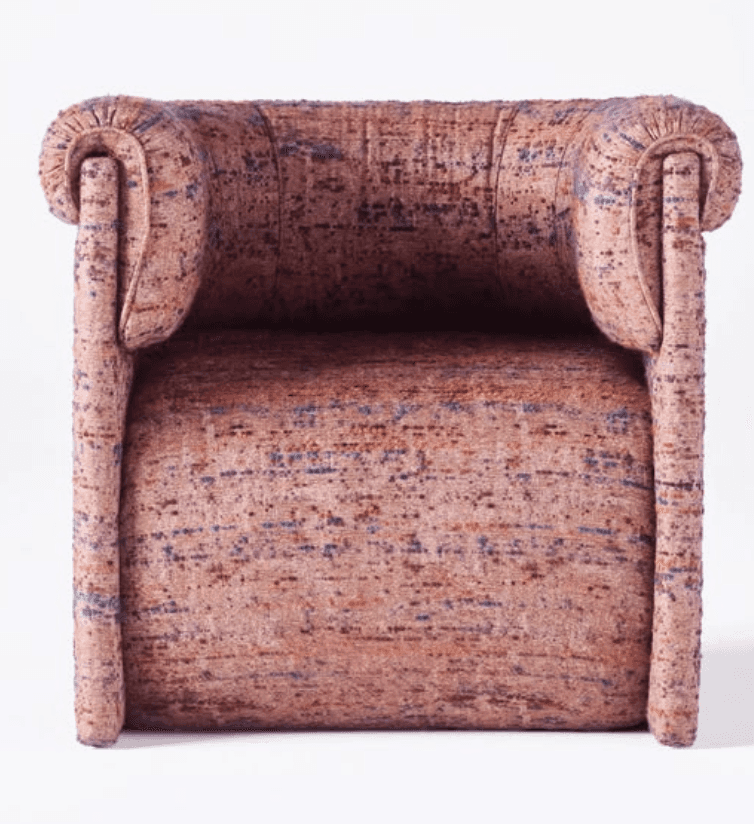 A single armchair with a plush, upholstered design. The armchair features rounded armrests that curv… — 3D model