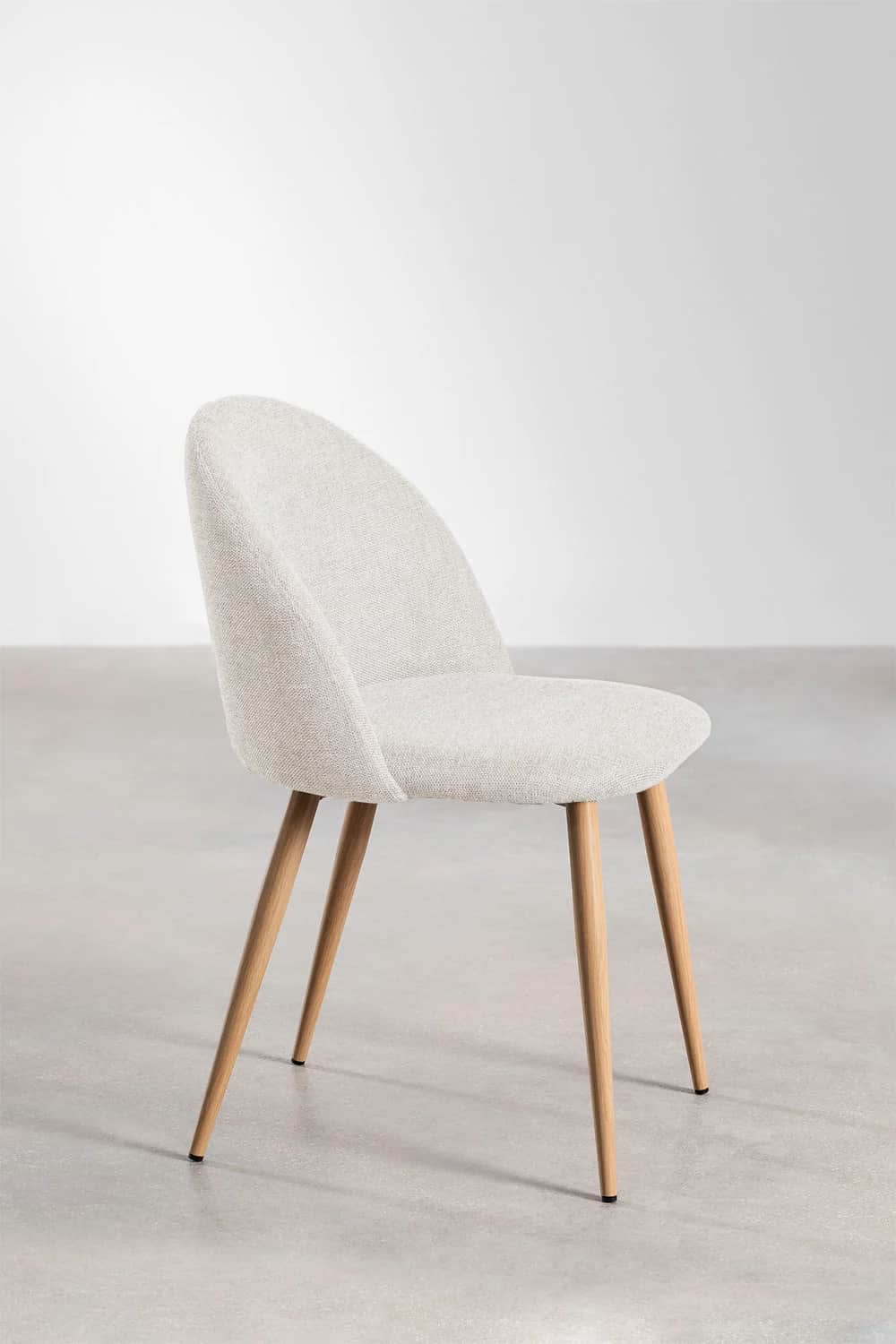 An armless side chair with a gently curved, upholstered backrest and seat, supported by four tapered… — free GLTF 3D model