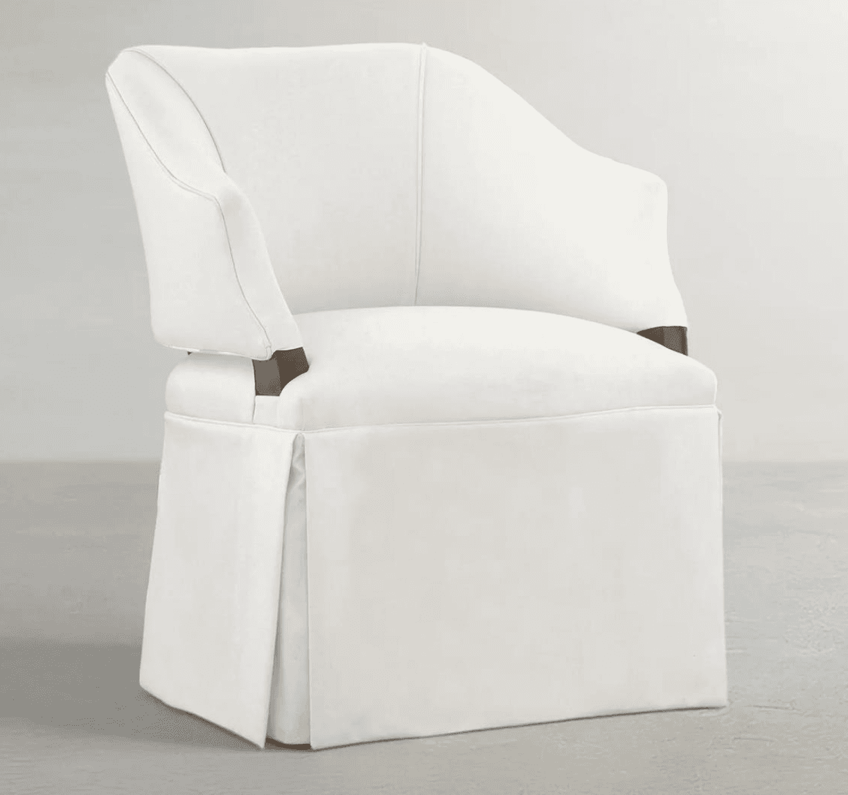 A fully upholstered armchair featuring a clean, off-white fabric and a skirted base that conceals th… — 3D model