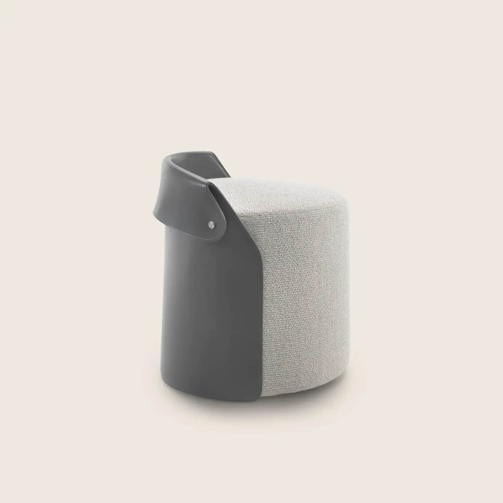 A compact, cylindrical stool featuring a two-tone design. The main body is upholstered in a light gr… — 3D model