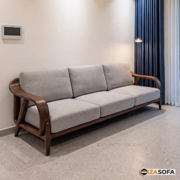 A three-seater sofa featuring a distinctive exposed wooden frame with gracefully curved armrests and… — 3D model