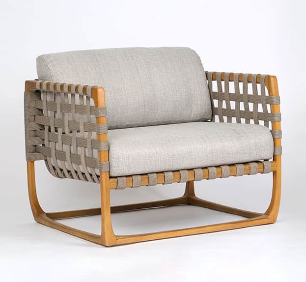 A modern lounge chair featuring a natural wood frame, woven strap detailing on the arms and back, an… — free OBJ 3D model