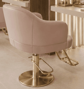 A modern hydraulic salon stylist chair featuring a plush, light pink upholstered seat and back, comp… — 3D model