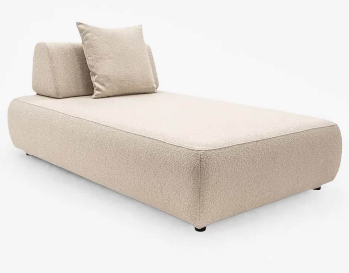 A modern daybed featuring a minimalist design. It is upholstered in a light beige, textured boucle f… — 3D model