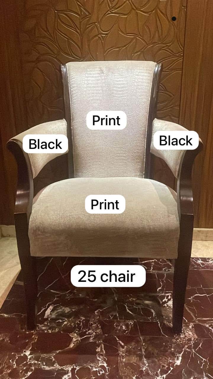 An upholstered armchair featuring a dark stained wooden frame, a light beige patterned fabric on the… — free OBJ 3D model