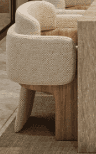 A contemporary armchair featuring a rounded, upholstered seat and back in off-white boucle fabric, s… — free OBJ 3D model