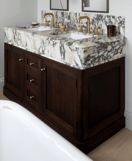 A double sink bathroom vanity with a marble countertop and wooden base. The vanity features two unde… — 3D model