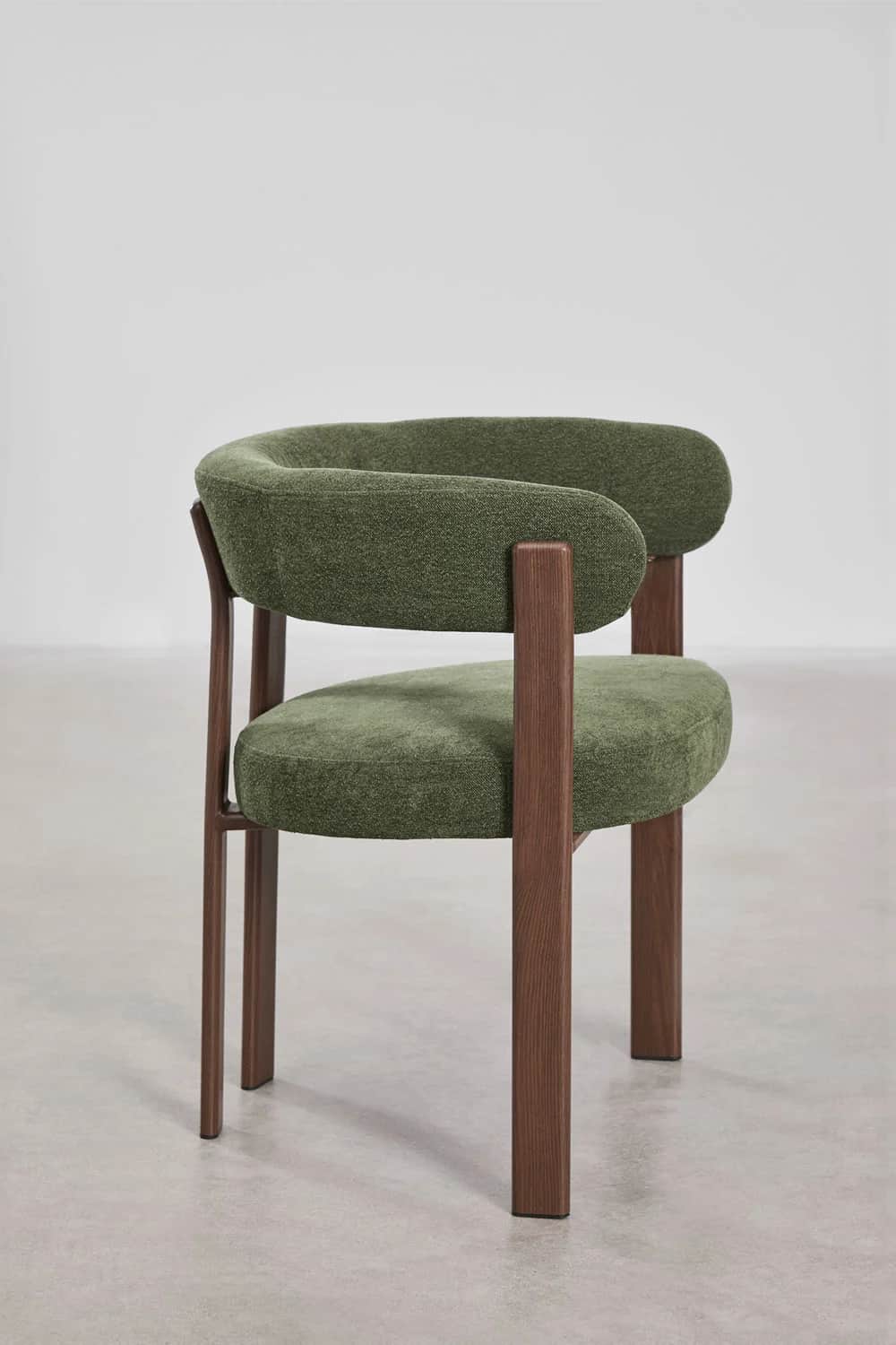 A modern accent chair featuring a curved upholstered backrest and seat in a textured green fabric. T… — free GLTF 3D model