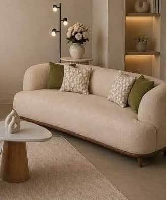 A contemporary curved sofa upholstered in light beige fabric, featuring a continuous rounded backres… — free GLTF 3D model