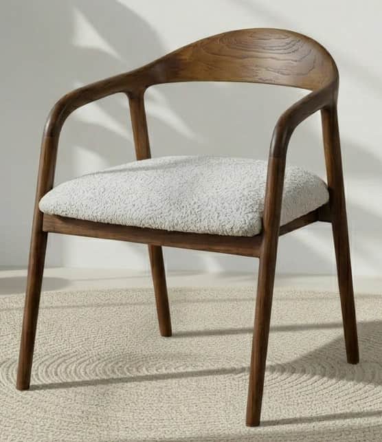 A modern armchair with a curved wooden frame and a cushioned seat. The frame features a rounded back… — 3D model