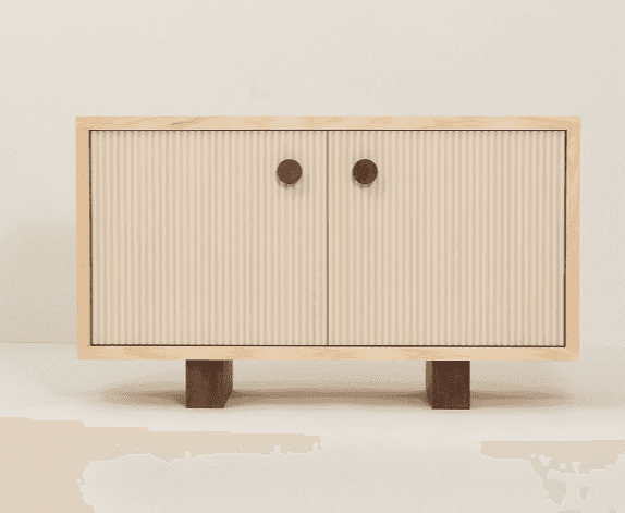 A cabinet with two doors and a light wood frame. The doors have a ribbed texture and are adorned wit… — 3D model