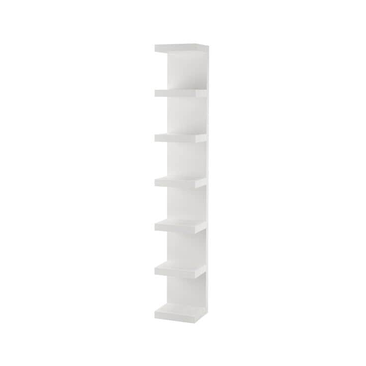 A tall, narrow, white shelving unit featuring multiple open shelves arranged vertically, designed fo… — free BLEND 3D model