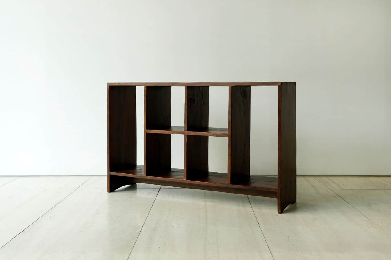 A dark brown wooden shelving unit with multiple open compartments, featuring a solid construction an… — 3D model
