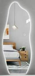 An asymmetrical wall mirror with an organic, free-form silhouette and frameless design. — 3D model