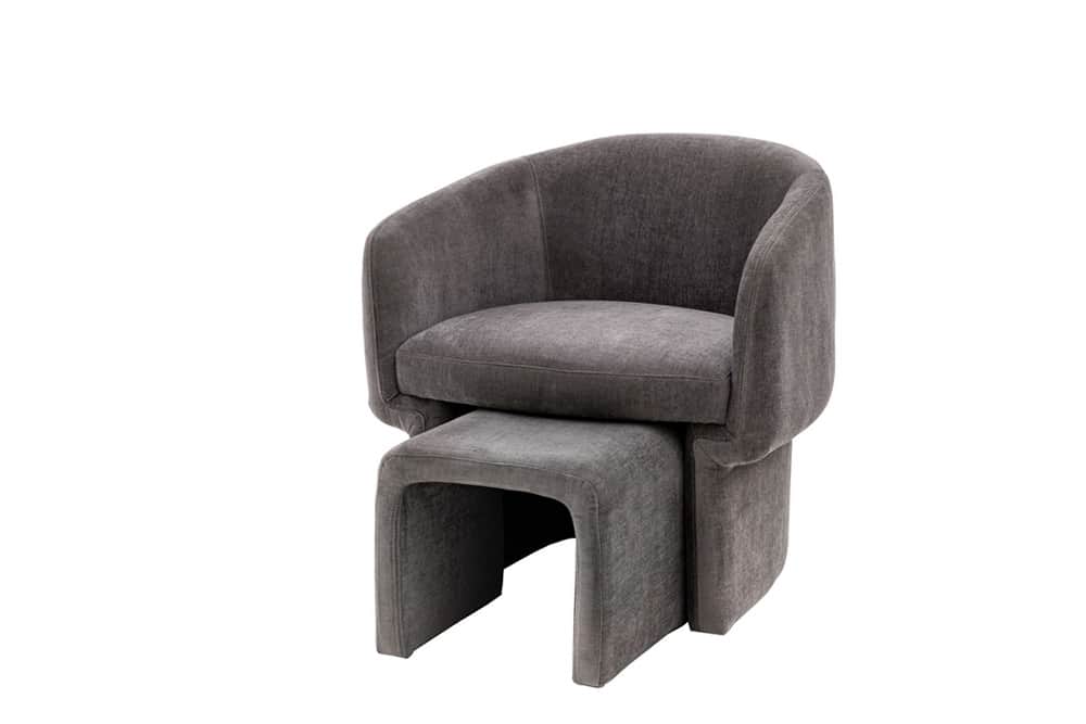 A modern upholstered armchair with a matching ottoman. The armchair features a rounded back and arms… — 3D model