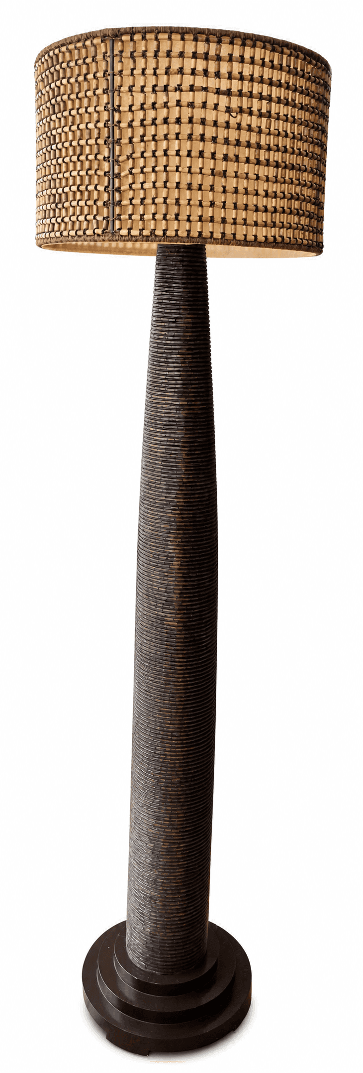 A floor lamp featuring a cylindrical, tapered body constructed from stacked, dark-colored material,… — free FBX 3D model