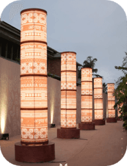 A tall, cylindrical floor lamp featuring a segmented body composed of multiple stacked sections, eac… — 3D model