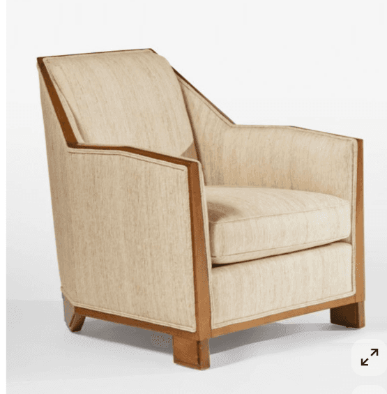 A upholstered armchair with a wooden frame. The armchair features a high, angular backrest and armre… — 3D model