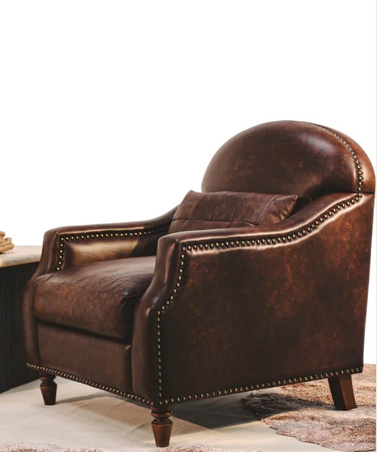 A vintage-style armchair upholstered in dark brown distressed leather. The chair features a high, ro… — free OBJ 3D model
