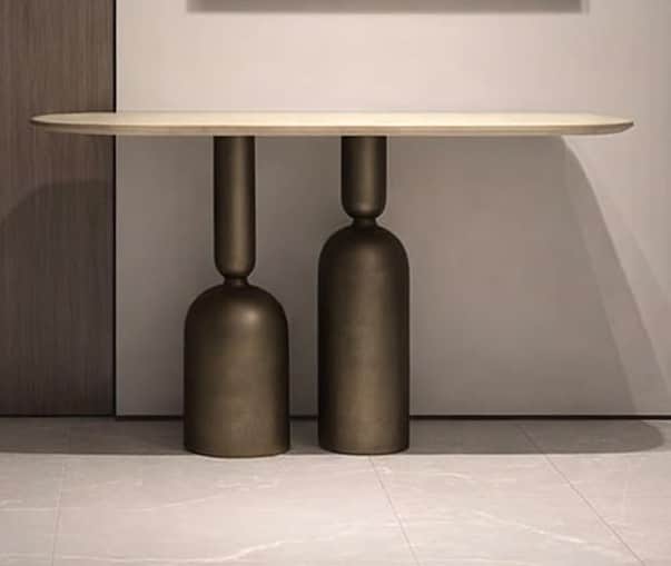 An elongated console table with a light, oblong top and two substantial, sculptural bases in an aged… — free BLEND 3D model