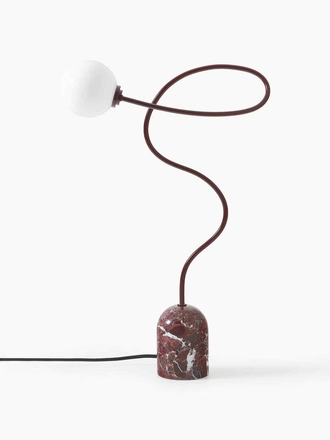 A contemporary table lamp with a distinctive design. It features a base made of red and white veined… — 3D model