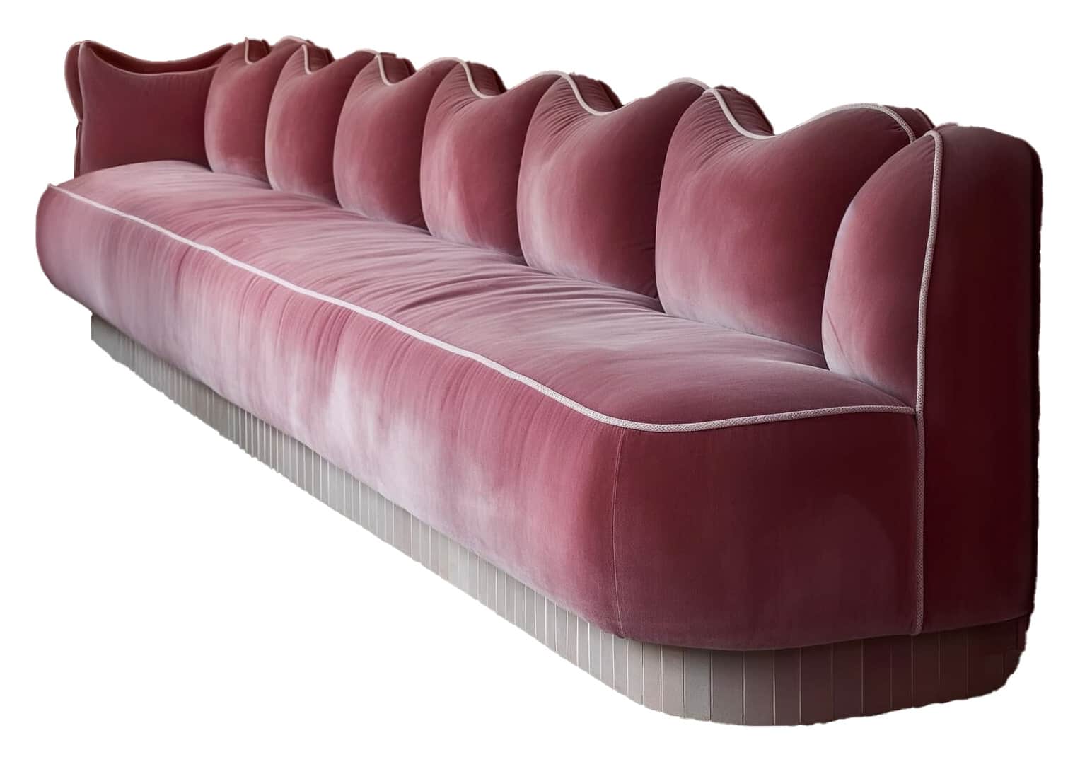 A long, plush sofa with a distinctive wave-like backrest design. The upholstery appears to be velvet… — 3D model