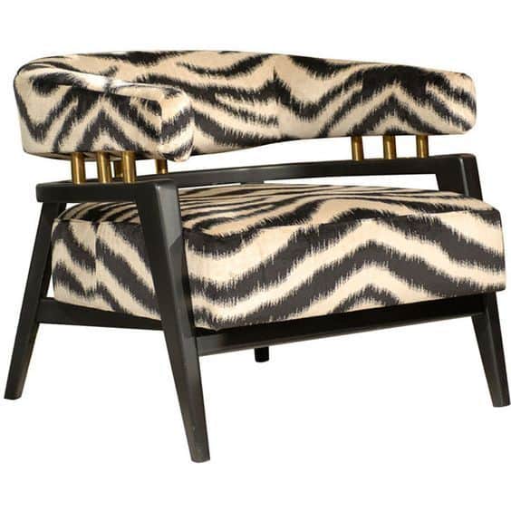An upholstered accent armchair featuring a black and off-white zig-zag patterned fabric, a dark wood… — free OBJ 3D model