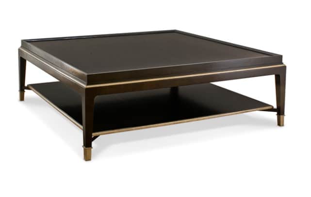 A square coffee table featuring a dark finish, a lower storage shelf, and brass details. The top sur… — 3D model