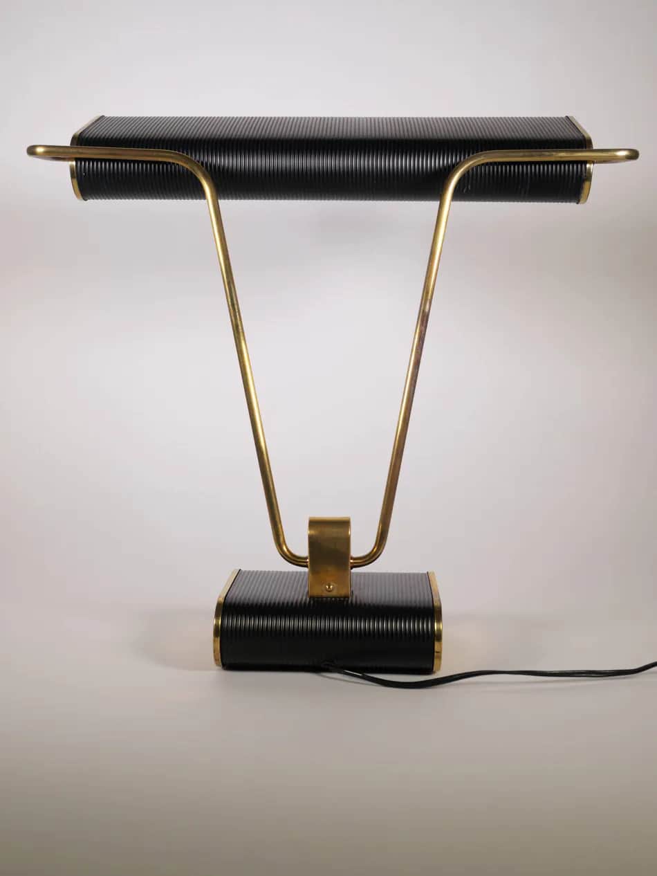 A stylish mid-century industrial desk lamp featuring a horizontal, rectangular, ribbed black shade a… — 3D model