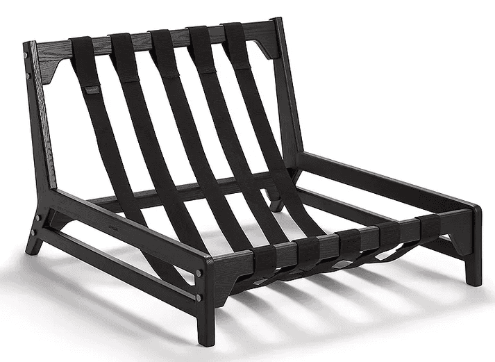 A modern, low-slung lounge chair frame constructed from black-stained wood with exposed black textil… — 3D model