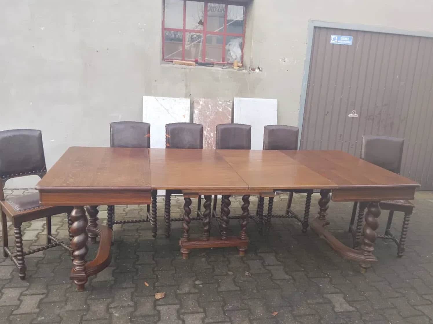 A complete dining set featuring a large wooden table with intricate barley twist legs and what appea… — 3D model