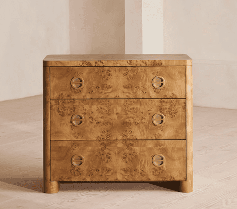 A three-drawer chest of drawers crafted with burl wood veneer, featuring rounded corners and edges,… — 3D model
