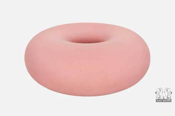 A circular ottoman with a matte finish, resembling a torus or a donut shape. It has a smooth, contin… — 3D model