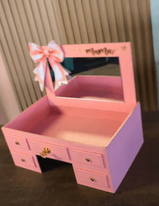 A miniature pink vanity unit designed for tabletop use, featuring a mirrored back panel with the wor… — 3D model