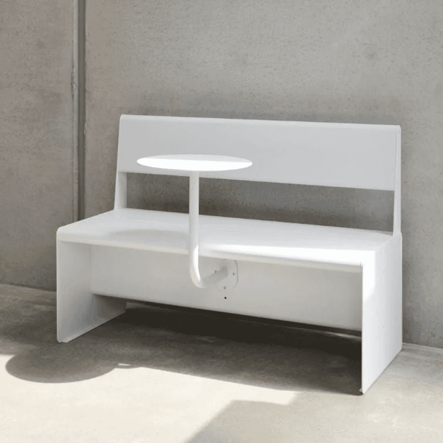 A modern, white bench with a built-in backrest and a small, round side table attached to a curved su… — 3D model