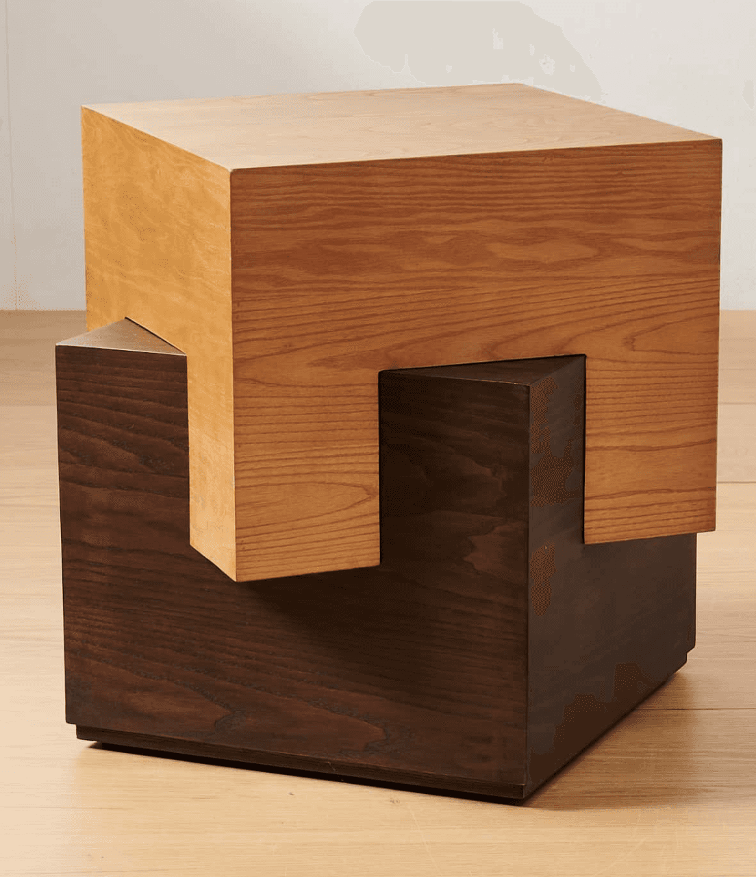 A unique end table with a cube-like design, featuring two distinct wooden blocks. The upper block is… — 3D model