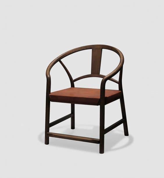 A dark wood armchair featuring a distinctive continuous, horseshoe-shaped backrest and armrests, pai… — 3D model
