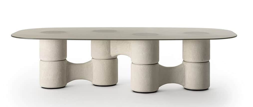 An oval-shaped coffee table with a smooth, matte finish glass top and a unique, sculptural base. The… — free OBJ 3D model