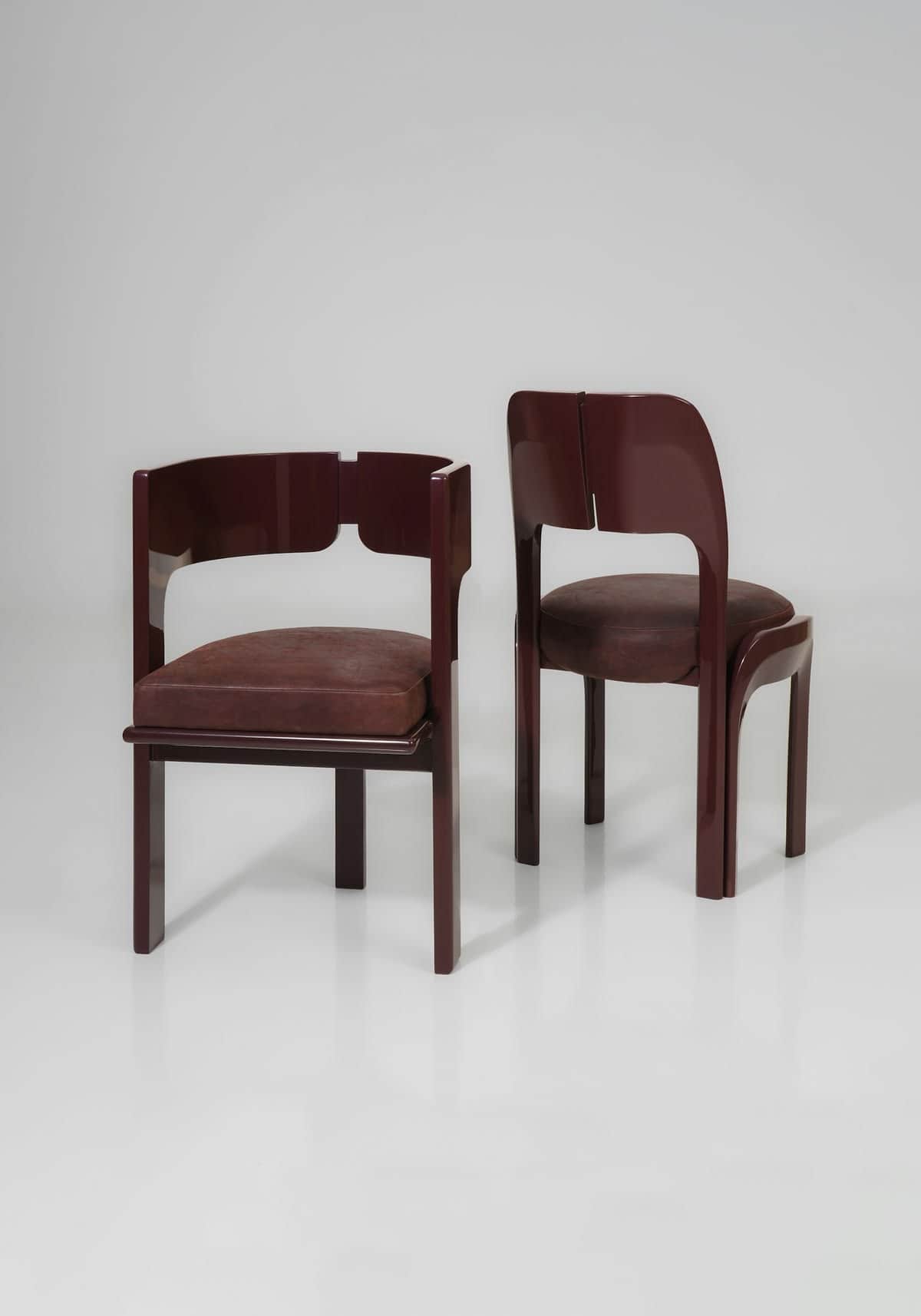 A striking postmodern armchair featuring a continuous, curved armrest and backrest in a high-gloss d… — free OBJ 3D model