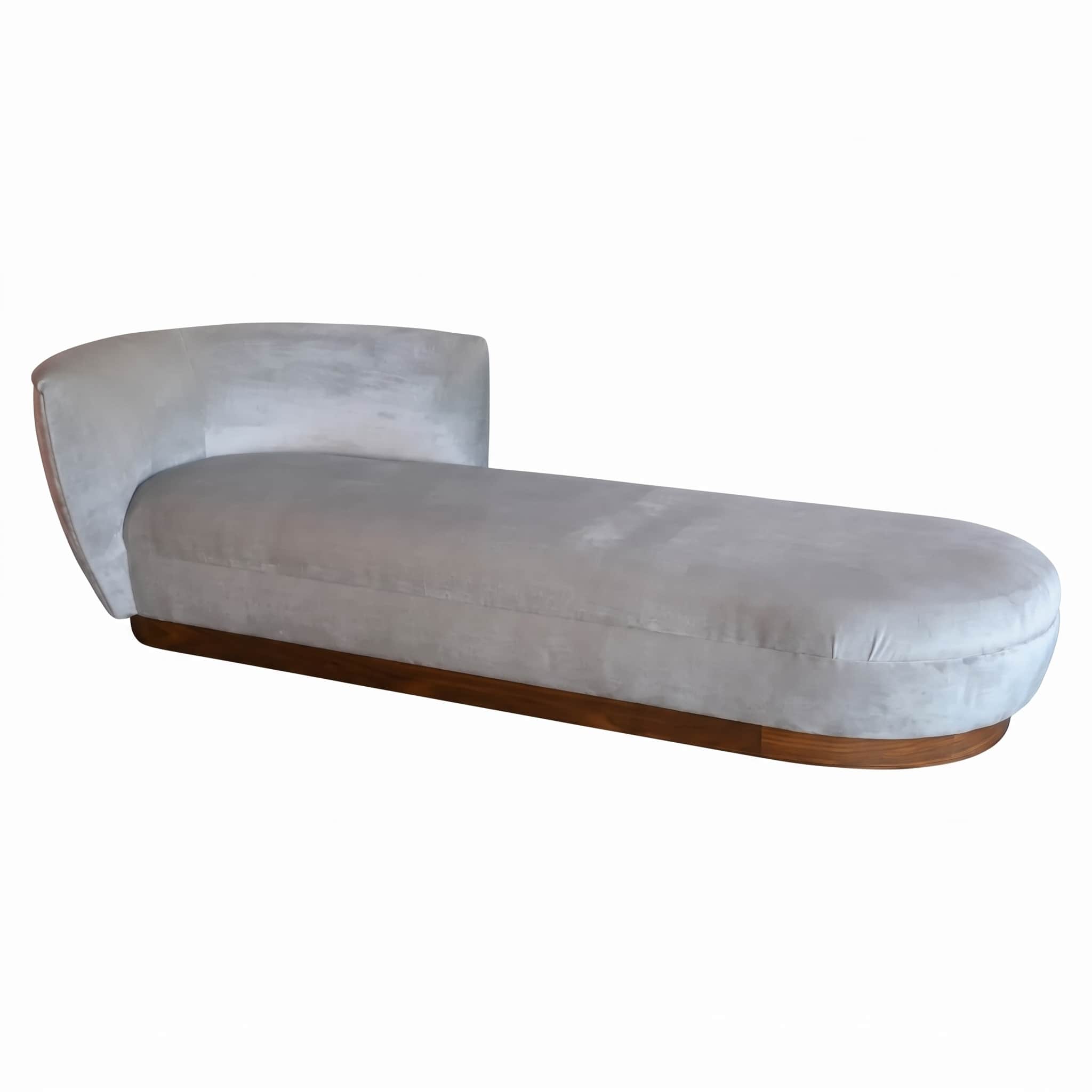 An elegant, modern chaise lounge featuring a light grey velvet upholstery and a curved backrest, sup… — 3D model