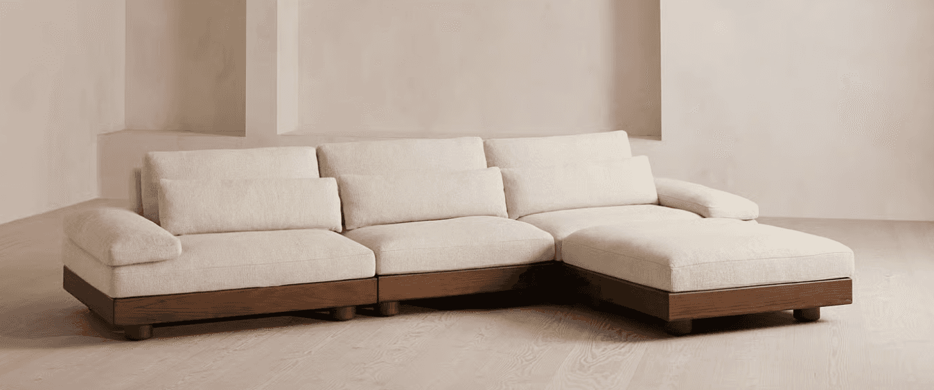 A sectional sofa featuring a modular design. It has a low profile with deep seating cushions and a c… — 3D model