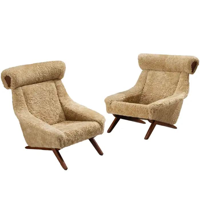 A high-backed lounge chair upholstered in shaggy, light-colored sheepskin or faux sheepskin fabric,… — 3D model