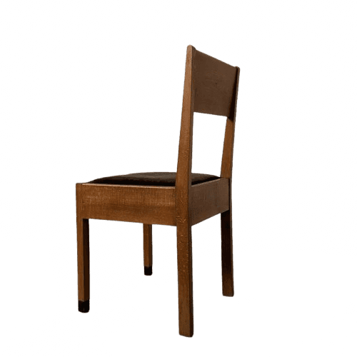 A side chair constructed primarily from medium-toned solid wood, featuring a rectangular upholstered… — 3D model