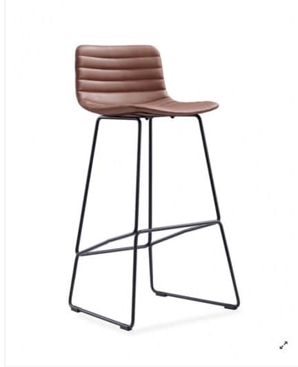 A modern bar stool featuring a brown channel-tufted leatherette seat and backrest, supported by a mi… — 3D model
